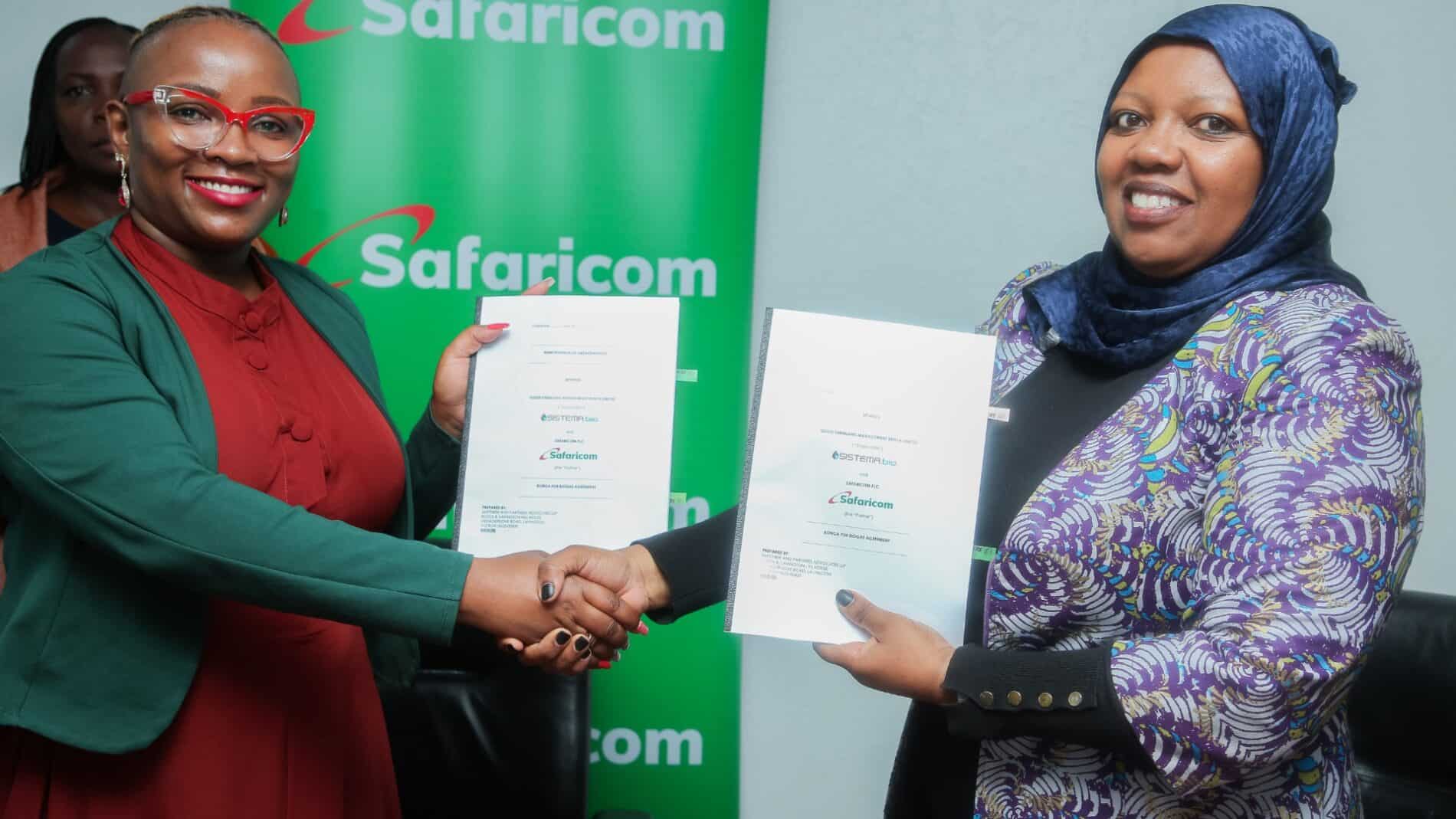 Eng. Madrin Maina of Sistema.bio and Fawzia Ali-Kimanthi of Safaricom PLC shake hands after signing the 'Bonga for Biogas' partnership in Nairobi.