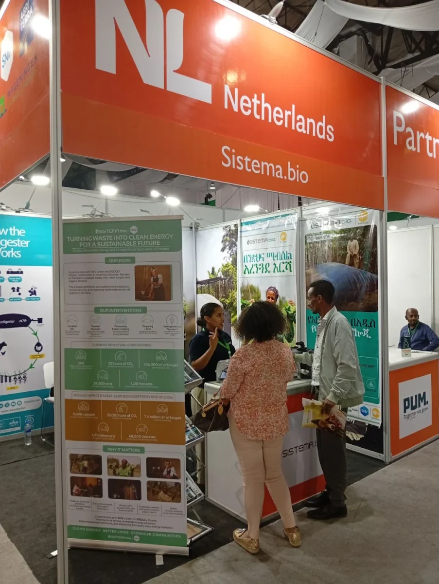 Visitors gathered at the Sistema.bio stand during ALEC Ethiopia 2025, asking questions about biogas technology and livestock innovation