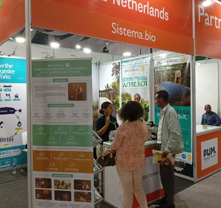 Visitors gathered at the Sistema.bio stand during ALEC Ethiopia 2025, asking questions about biogas technology and livestock innovation